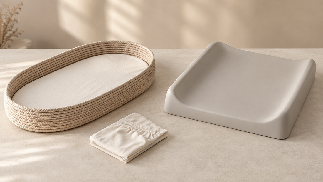 Illustrative comparison of a woven changing basket and a contoured changing pad, with a folded spare cover.